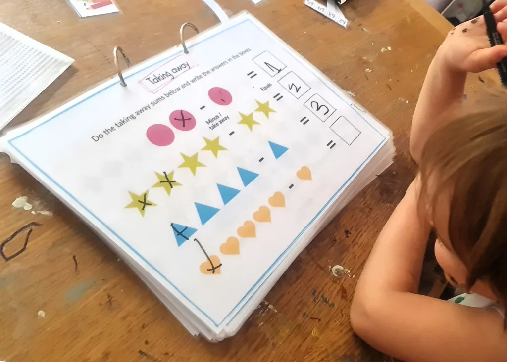 Adding and taking away - maths activity book