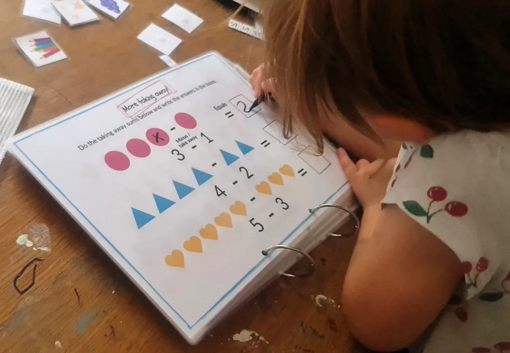 Adding and taking away - maths activity book