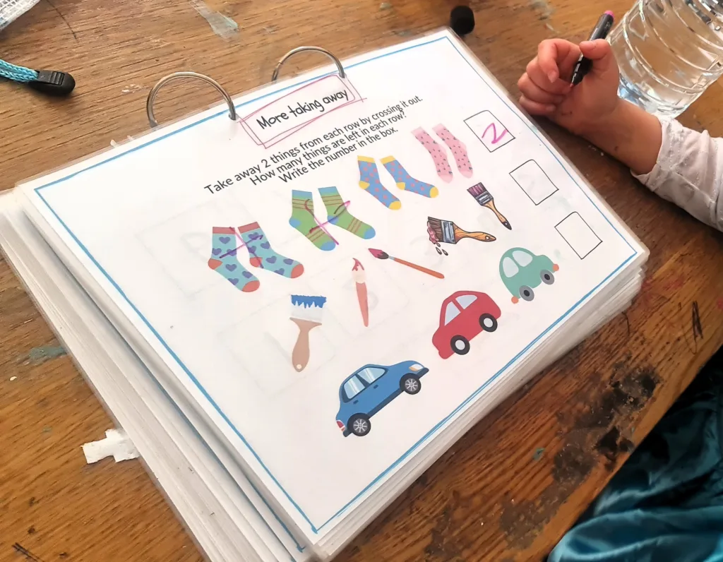 Adding and taking away - maths activity book